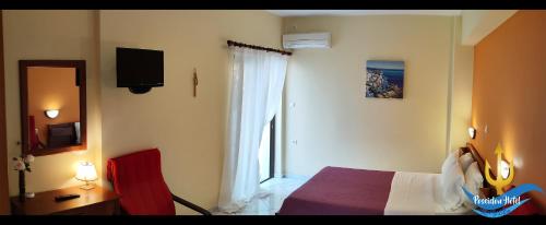 Postel nebo postele na pokoji v ubytování Poseidon Hotel Karystos
