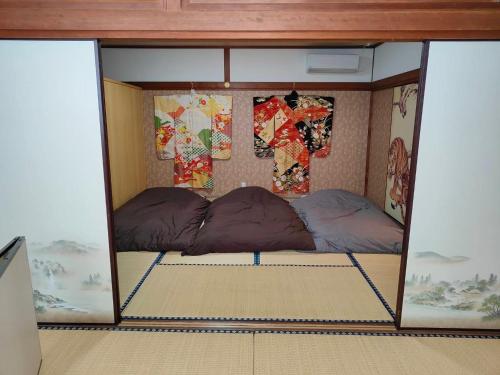 a room with two beds in a room at Morita-ya Japanese style inn ToraーVacation STAY 62447 in Tamana