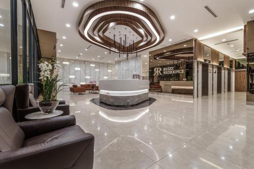 a lobby with a large building with a lobbyasteryasteryasteryasteryasteryasteryastery at Reizz Residence By Sweet Home in Kuala Lumpur