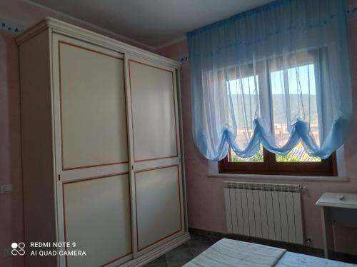 Postel nebo postele na pokoji v ubytování CASA DEL CASTAGNO NARBOLIA