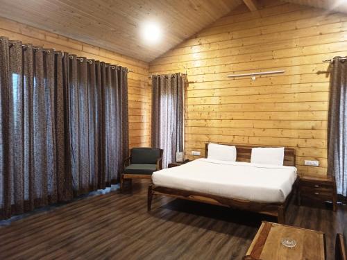 Postel nebo postele na pokoji v ubytování Rishat Sngi Orchid Resort, Shillong