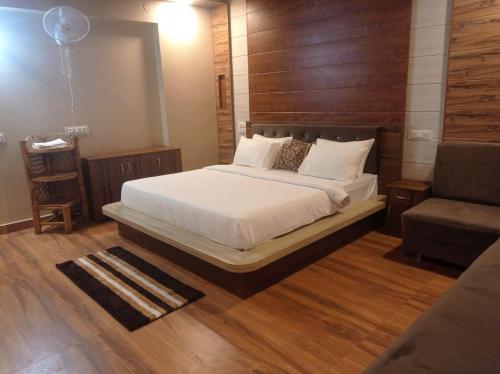 A bed or beds in a room at The Palash Vann Pench