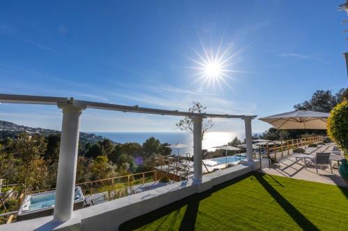 a view from the balcony of a house with a lawn at Dimora Maiuri L'Olivella in Anacapri