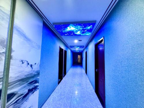 a hallway with a ceiling with a painting on it at 怡程酒店ECHENG HOTEL in Sihanoukville