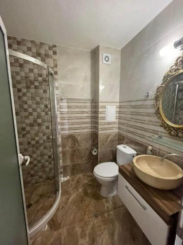 a bathroom with a sink and a toilet and a shower at Sweety SP apartments in Sunny Beach
