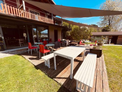 a white picnic table and chairs on a patio at Agriturismo Il Cucchiaio di Legno in Orta San Giulio
