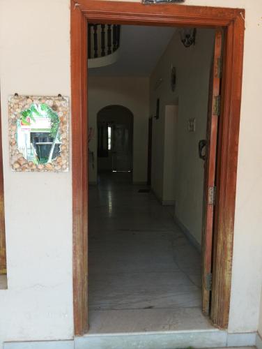 an open door to a hallway with a hallway leading into a room at Shree Eco Stay in Chennai