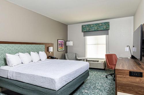 a hotel room with a bed and a desk at Hampton Inn & Suites Charleston-West Ashley in Charleston