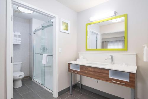 a bathroom with a sink and a mirror at Hampton Inn & Suites Hartford-Manchester in Manchester