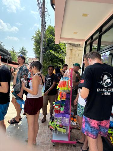 a group of people standing outside of a bus at Koh Tao Silver Na’s Hostel in Koh Tao