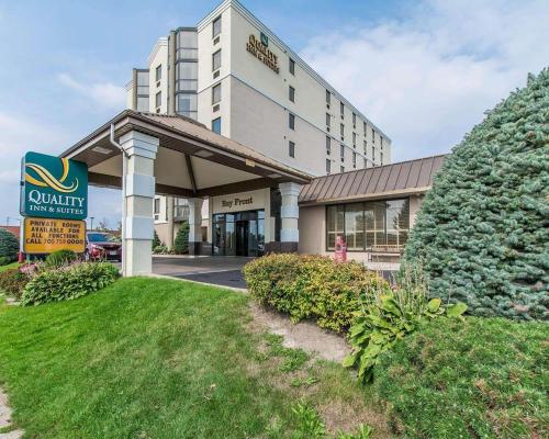 a hotel building with a sign in front of it at Quality Inn & Suites Bay Front in Sault Ste. Marie