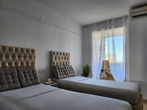 Ένα ή περισσότερα κρεβάτια σε δωμάτιο στο CASABLANCA DUPLEX apartamentos