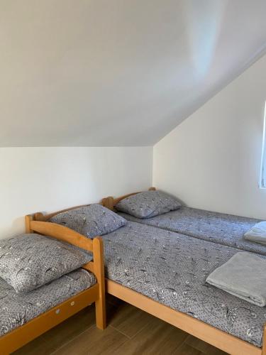a bedroom with two bunk beds in it at Vikendica na dan in Novi Sad