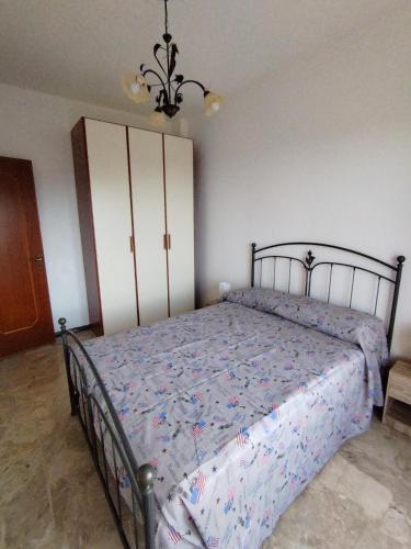 a bedroom with a large bed with a bed sqor at Casa ivo in Perinaldo
