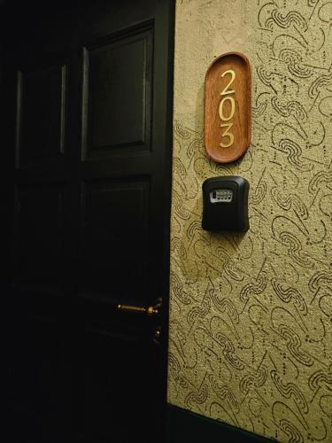 a door with a number on the side of it at 85 Boutique Hotel in Ipoh