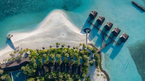 an aerial view of an island in the ocean at Fushifaru Maldives with 50 percent off on sea plane roundtrip 04 nights & above in Fushifaru