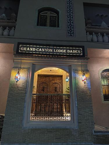 a front entrance to a building with a wooden door at Grand Canyon Lodge Dades in Aït Idaïr
