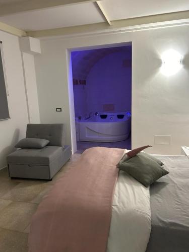 Postel nebo postele na pokoji v ubytování Fernanda's House - Incantevole con idromassaggio su richiesta