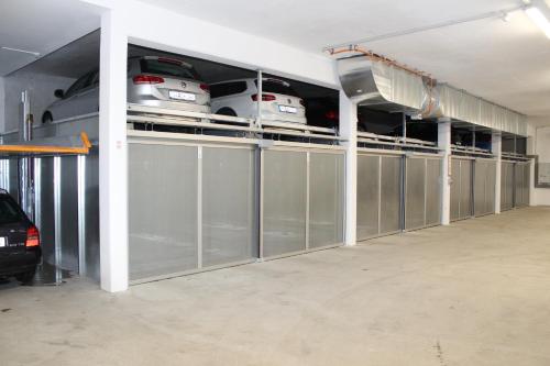 a garage with a row of cars on display at Der Sailer Hotel & Restaurant in Obertauern