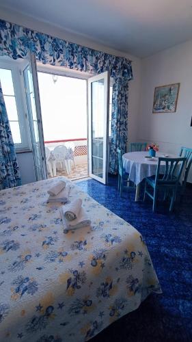 Ένα ή περισσότερα κρεβάτια σε δωμάτιο στο Casa del Mare