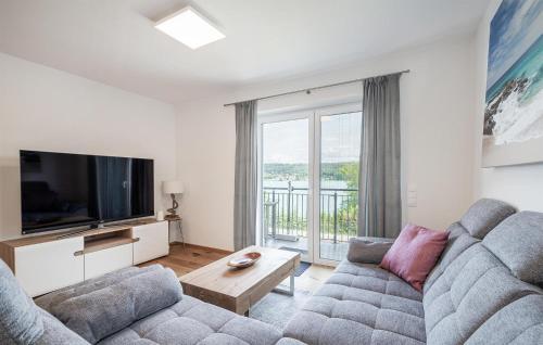 TV a/nebo společenská místnost v ubytování Seeblick-Apartment In Velden