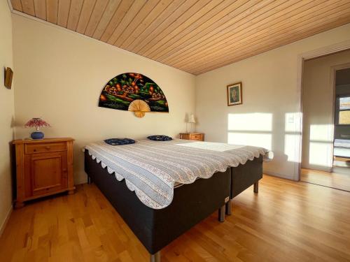 a bedroom with a large bed in a room at Sea & Mountain View 3 Bedroom in Leynar