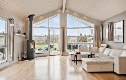 a living room with a couch and a table at Nice Home In Sjølund With Wifi in Sjølund