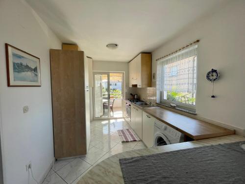 a kitchen with a sink and a counter top at Apartments Maria in Umag