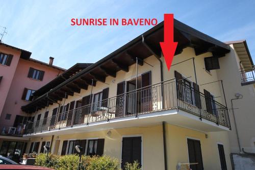 a building with a red arrow saying sunrise in bavango at Sunrise in Baveno in Baveno