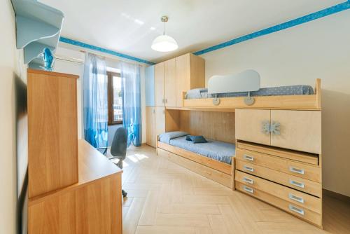 A bed or beds in a room at Il Mosaico Al Mare