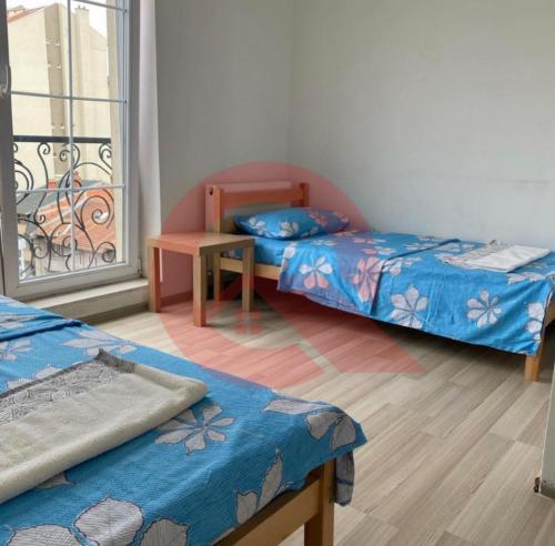 Ένα ή περισσότερα κρεβάτια σε δωμάτιο στο Cozy Apartment