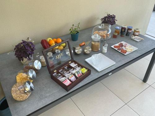 a table with a buffet of food on it at La sentinelle du Vallespir, Spa Sauna in Vivès