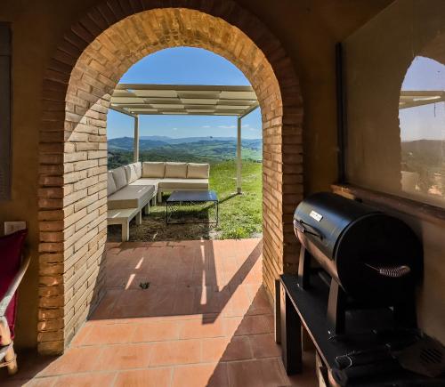 a view from the patio of a house with a grill at Prestigious Home - Pool, Gazebo, and Stellar Views in Mazzolla