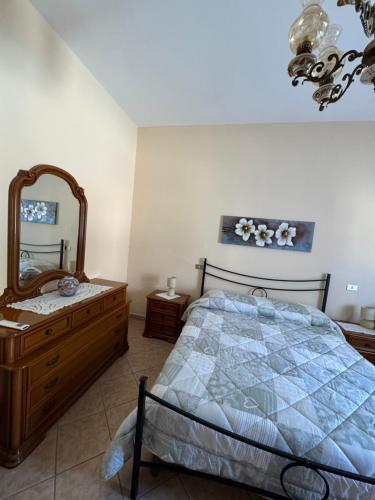 En eller flere senge i et værelse på Casa Olbia