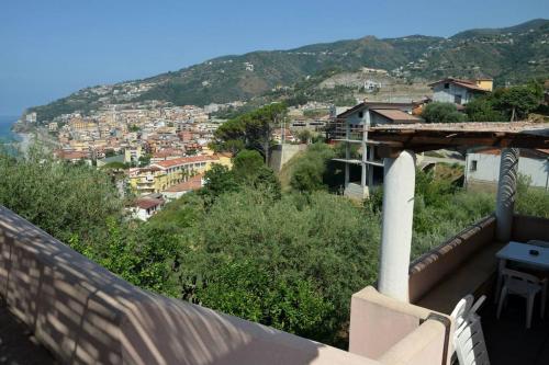 a view of a city from the balcony of a house at Appartamento per 2 persone con vista sulle Eolie Casa Spisidda "Lipari" in Gioiosa Marea