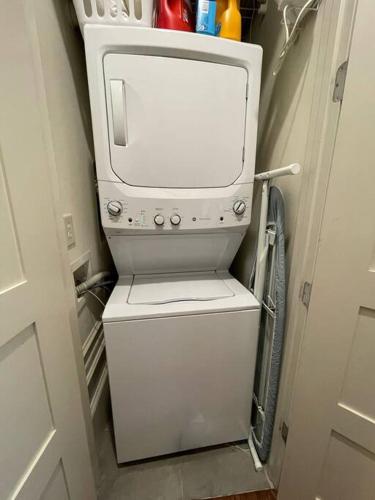 a washer and dryer in a small room at Downtown Condo*Balcony*River*Pet Friendly*Beach in Wilmington