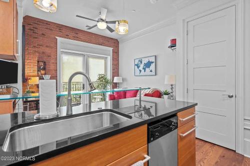 a kitchen with a stainless steel kitchen sink at Downtown Condo*Balcony*River*Pet Friendly*Beach in Wilmington