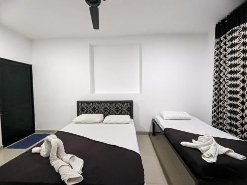 Postel nebo postele na pokoji v ubytování Big John Hotel