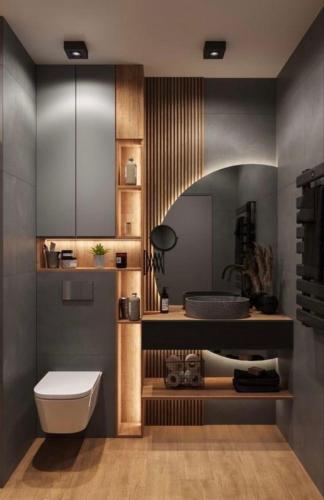 a bathroom with a white toilet and a sink at M Boutique Apartments in Thessaloniki
