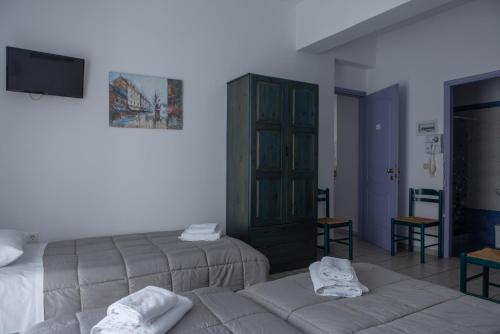 Katil atau katil-katil dalam bilik di Soula Rooms Tinos