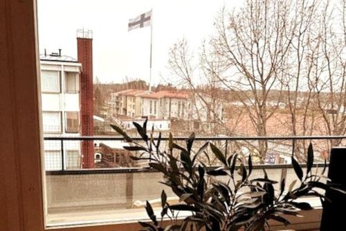 a view of a building from a window with a plant at Sibelius Kaksio Haminassa in Hamina