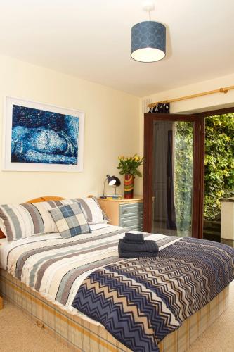 a bedroom with a bed and a window at Kieran's Place in Dublin