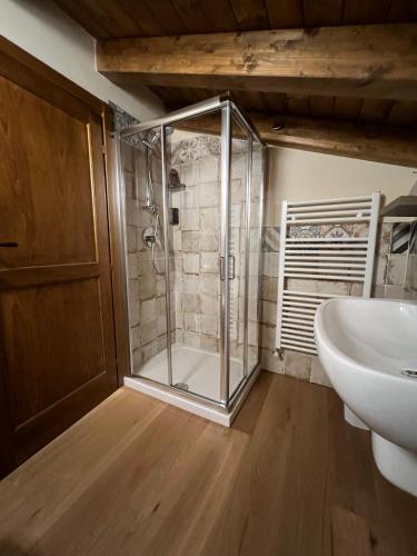 a bathroom with a shower and a sink at Locanda Fermento in Mochignano