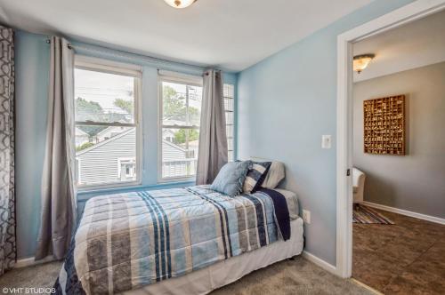 a bedroom with a bed and a large window at Chicago Big House in Chicago