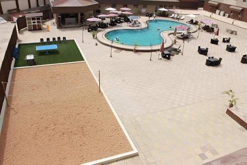 an overhead view of a swimming pool in a building at Sandralia Hotel in Abuja