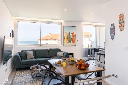 a living room with a couch and a table at CasaDami - Santa Cruz in Santa Cruz