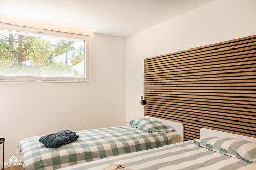 En eller flere senge i et værelse på CasaDami - Santa Cruz