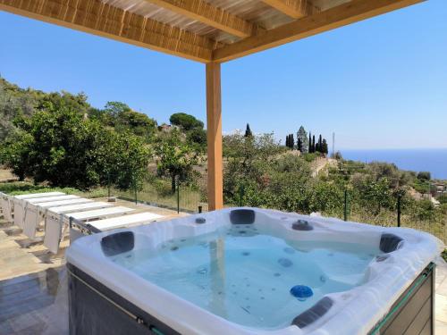 a hot tub on the patio of a house at Casal Trinacria in Santa Teresa di Riva
