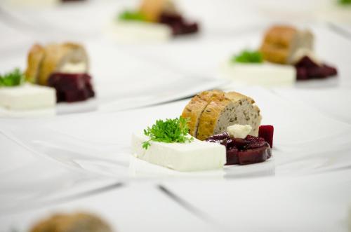 a row of different types of desserts on a plate at Hotel Welponer in Selva di Val Gardena