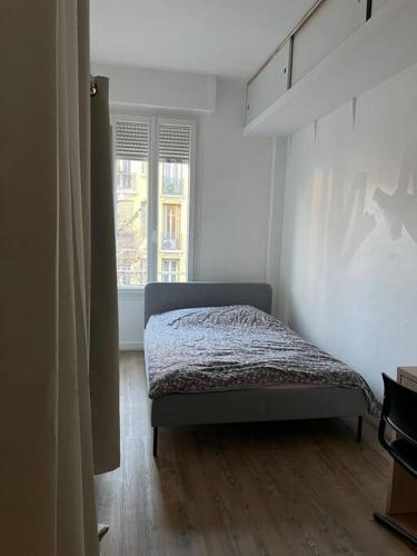 a bedroom with a bed and a window at Lovely 3 rooms Nice riquier next to Port with AC! in Nice